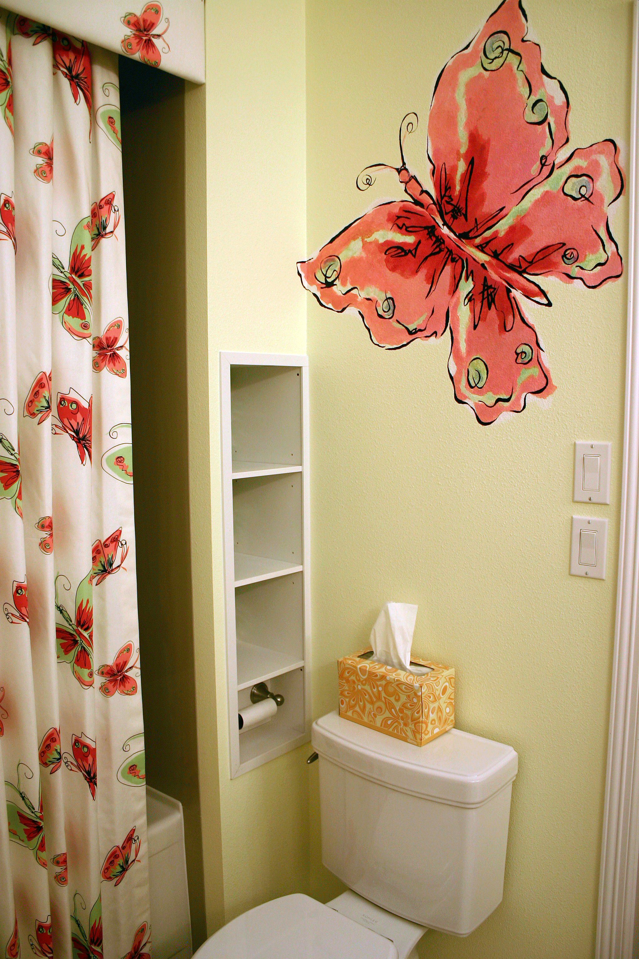 Huge, colorful butterfly in child's bathroom.