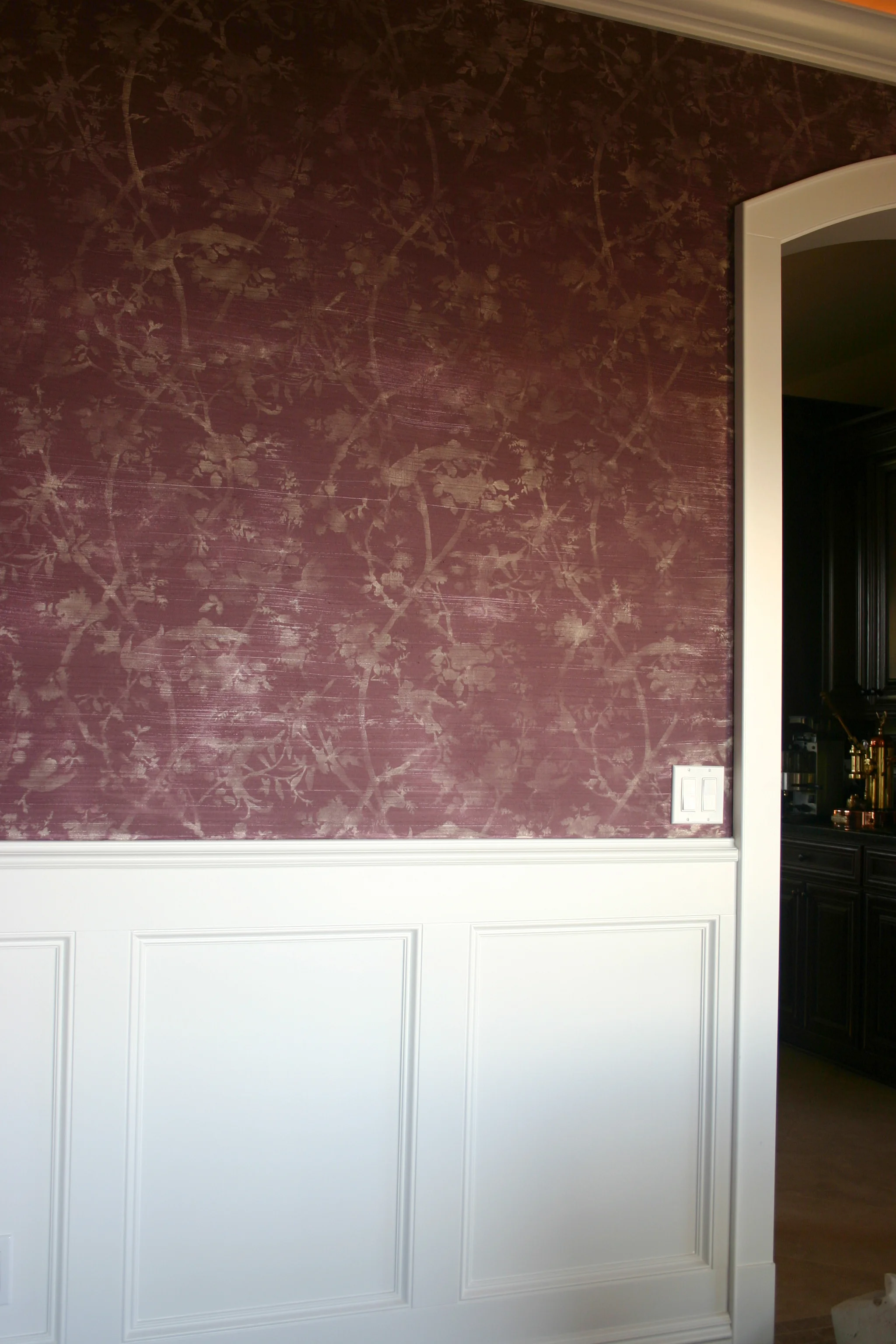 Hand stenciled "wallpaper" over hand trowled texture.