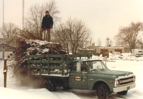 Gilbert Smith in 1982 on Arborsmith's first truck.