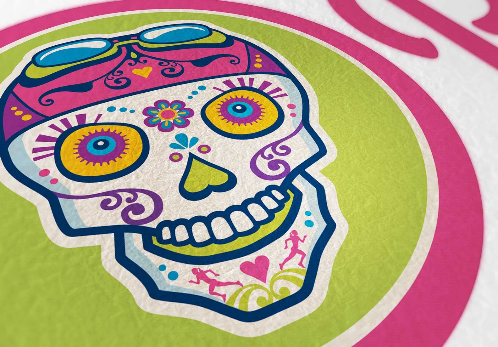 The client requested that the sugar skull feature elements of woman's multisport, swim cap and goggles, bike gears (eyes) and running (chin).