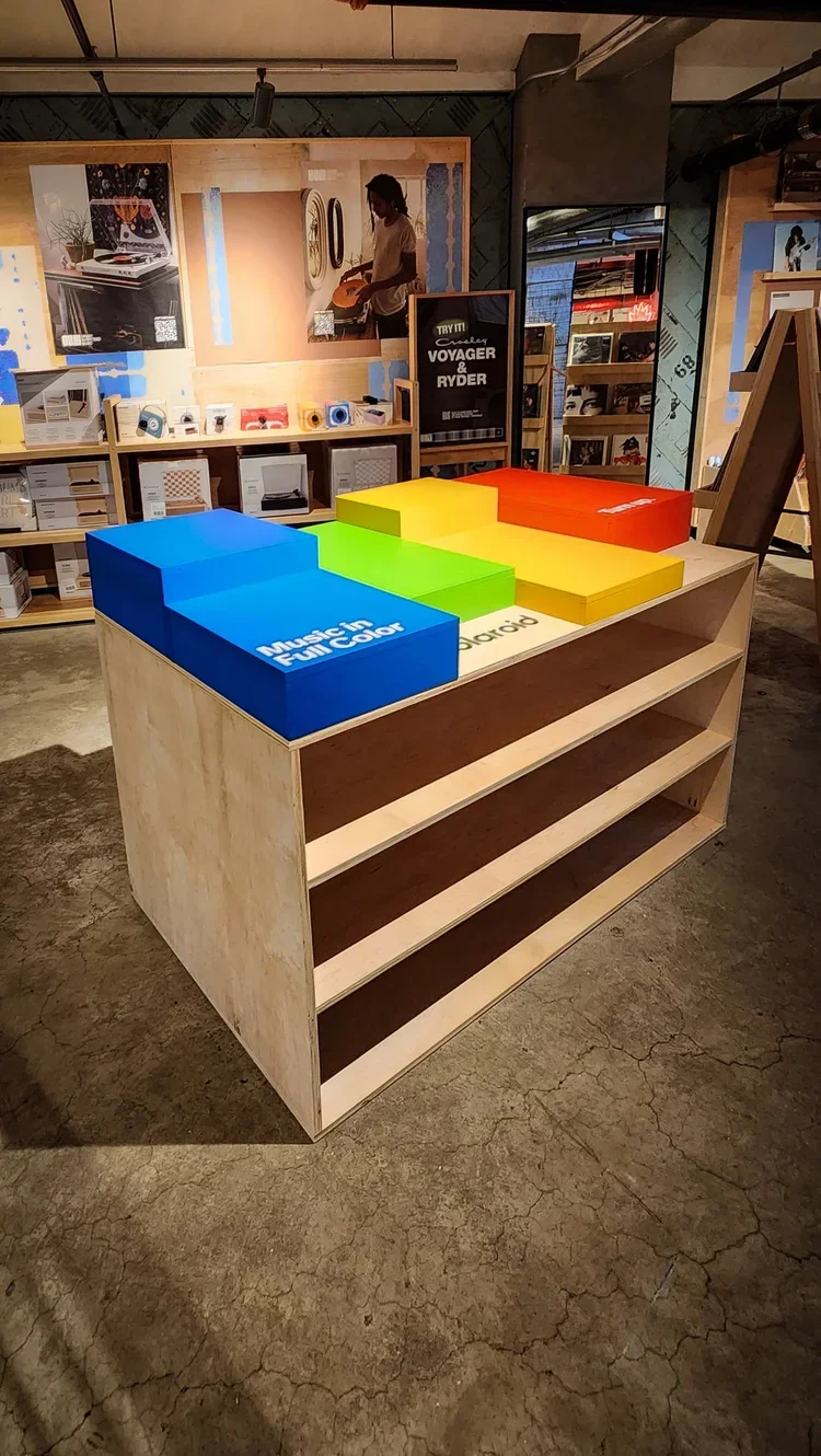   Polaroid - Urban Outfitters Flagship San Francisco    Custom fabricated shelving unit and custom wooden boxes with Polaroid Pantone painted in latex.   