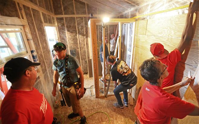 A tiny house-building workshop teaches veterans basic carpentry and building techniques. The three-day workshop was held on a farm in the Racine County community of Mount Pleasant. The tiny houses will provide transitional housing for homeless veterans. For more photos, go to jsonline.com/photos . Credit: Michael Sears