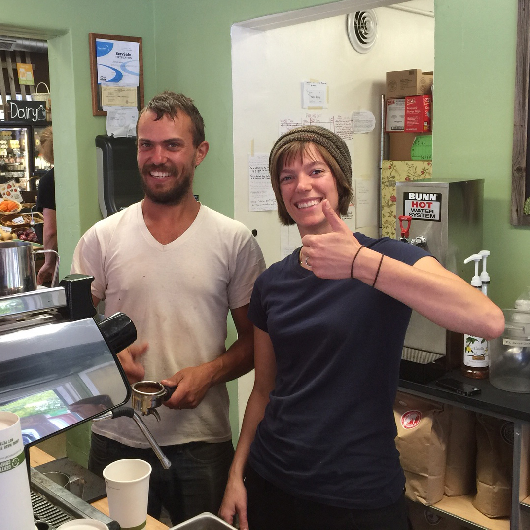 Our staff gets to do it all - refresh produce, take farmer's deliveries, help figure out where everything should go, and hone their barista skills! Here, farmer Nate Lada pitches in!