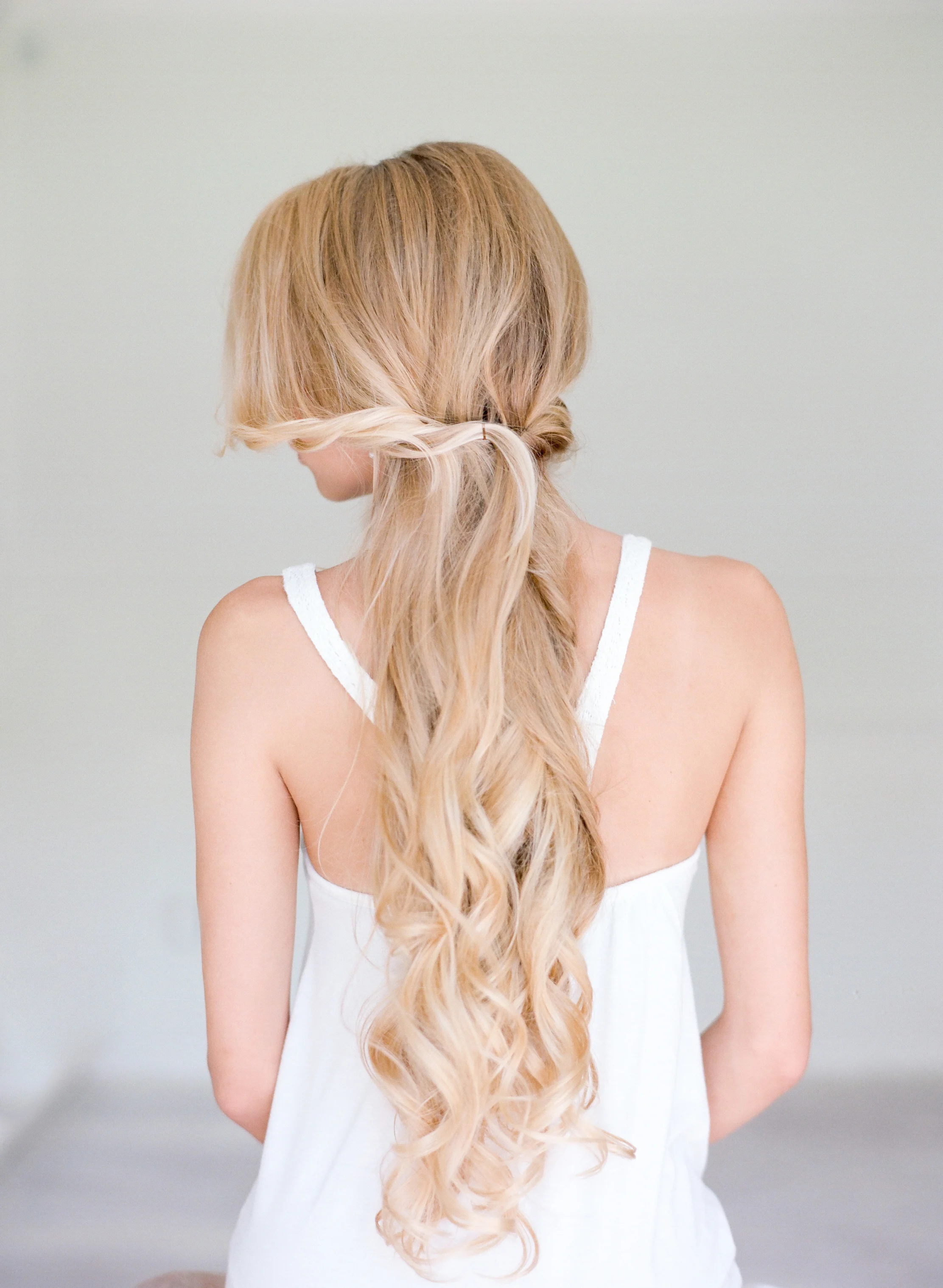 STEP FOUR | Twist a few front pieces away from the face meeting the other pinned pieces