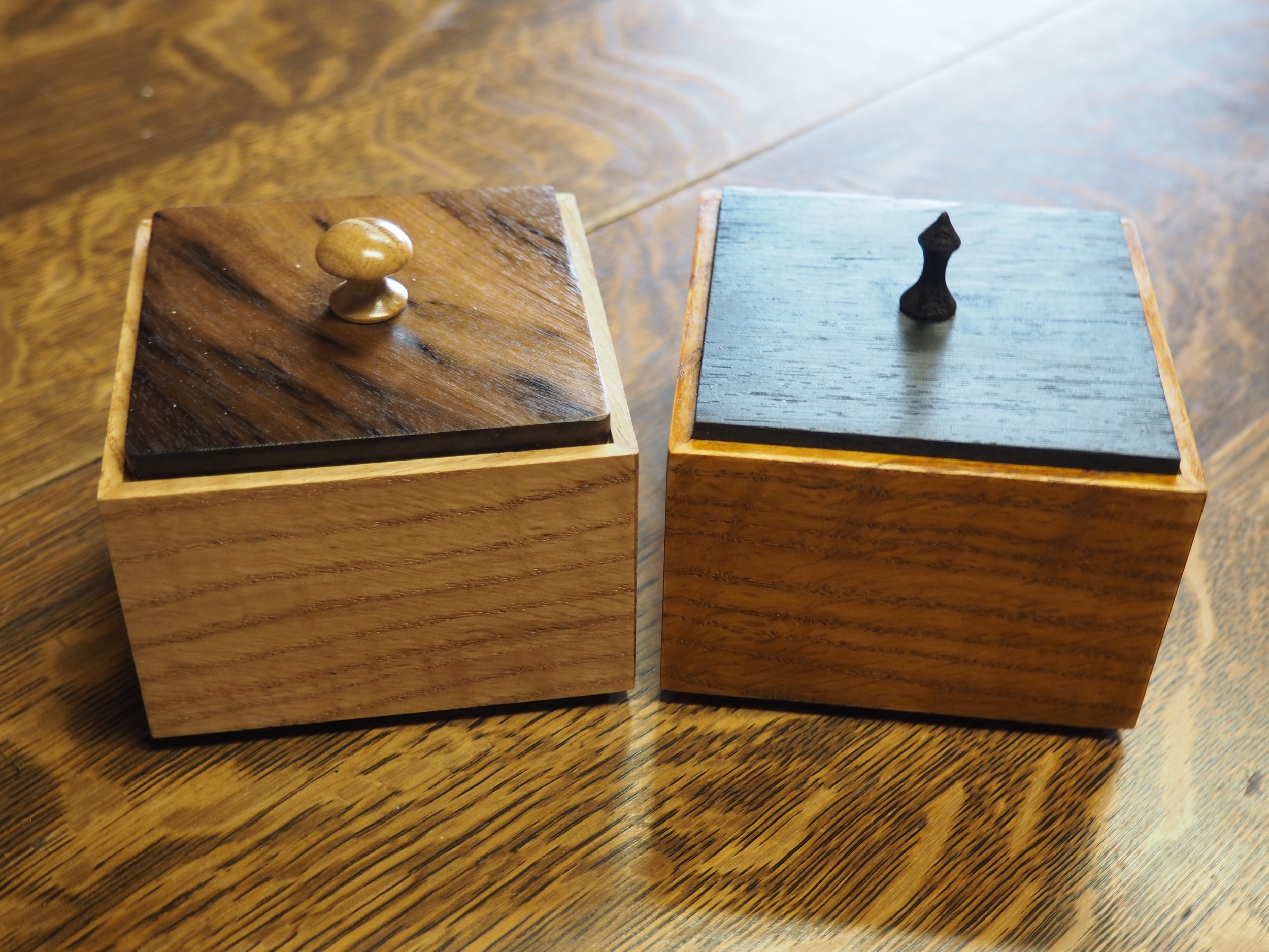 Box One is on the left, Box Two in the right. Both have Curly Red Oak bodies. Box One has a Spalted Oregon Myrtle top and Box Two has a Wenge top. Dimensions are 3x3x2¼, ¼ wall thickness.