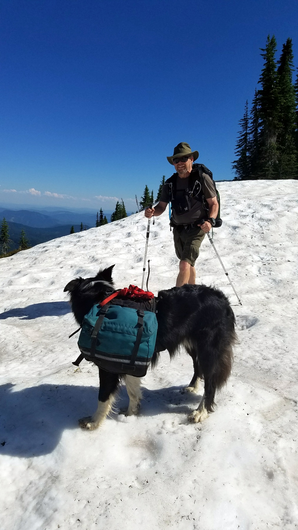 Mike loved the snow. Trail buried here by 4-10 feet of snow. Remnants of a cornice on the ridge. 