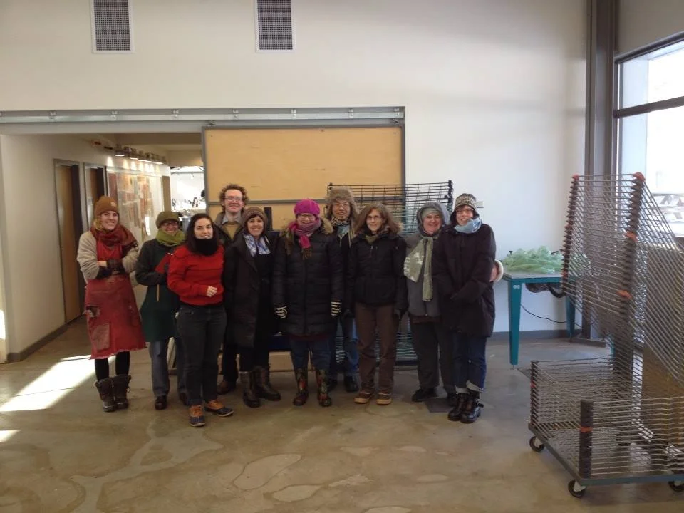Most of our group on the first day of the residency. The polar vortex managed to make its way all the way down to North Carolina. It was -6 the morning of this photo. The pipes had frozen causing the building to lose heat, but that didn’t keep our ever-intrepid group from getting to work in full winter wear. Photo credit: Emily Martin.