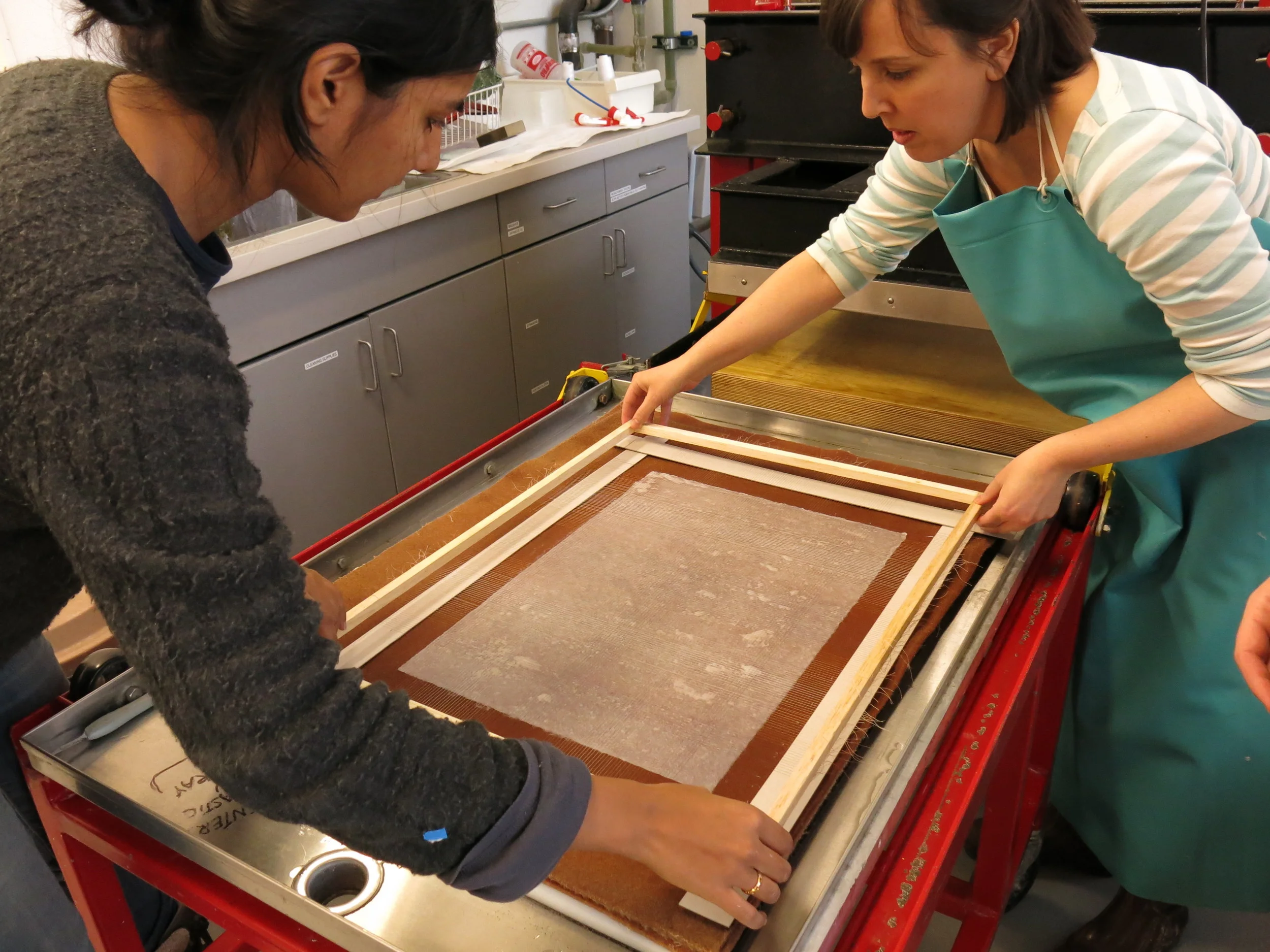 Radha and I concentrate on lining the grid up evenly.