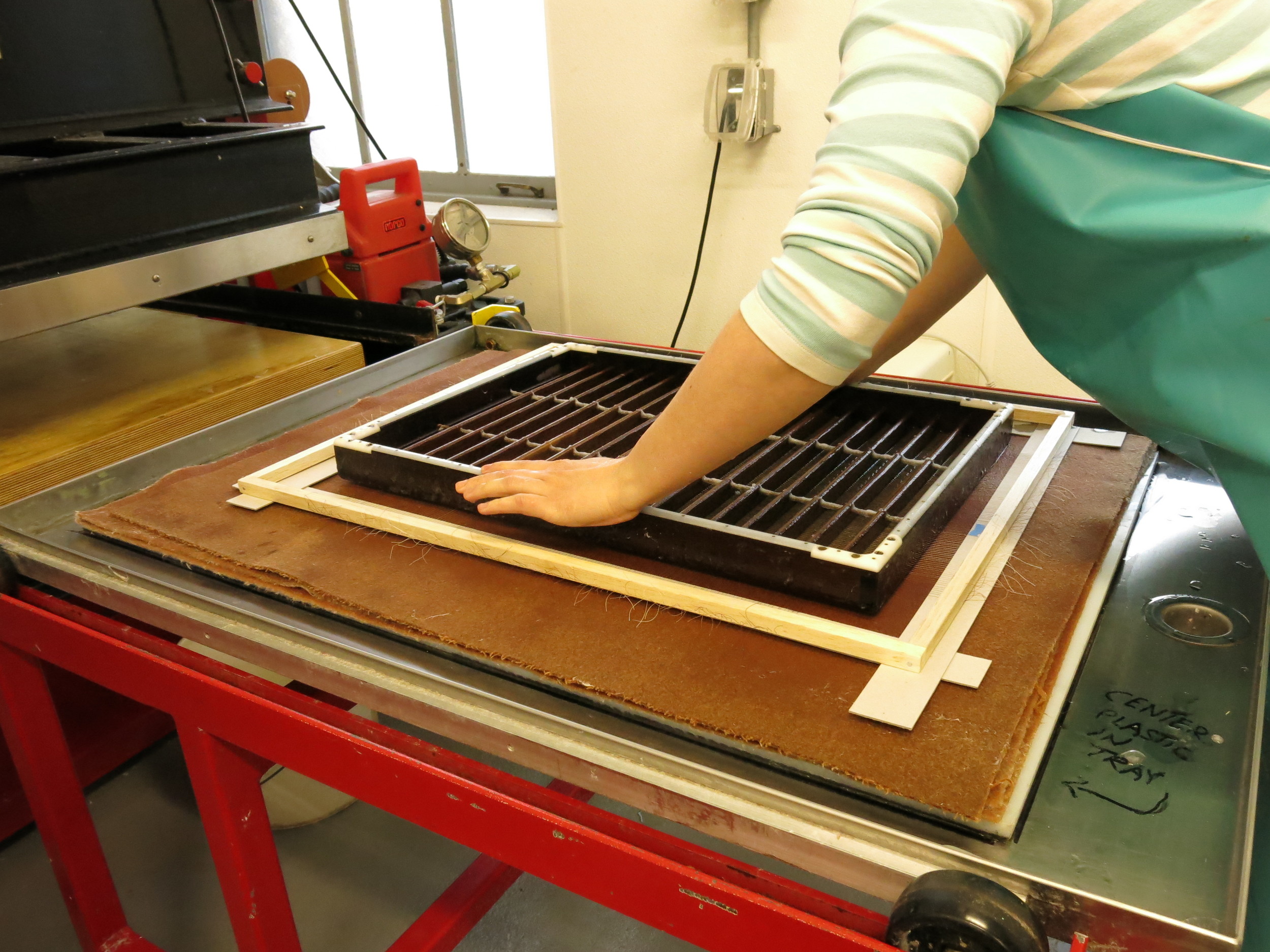 Couching the second sheet on top of the grid.