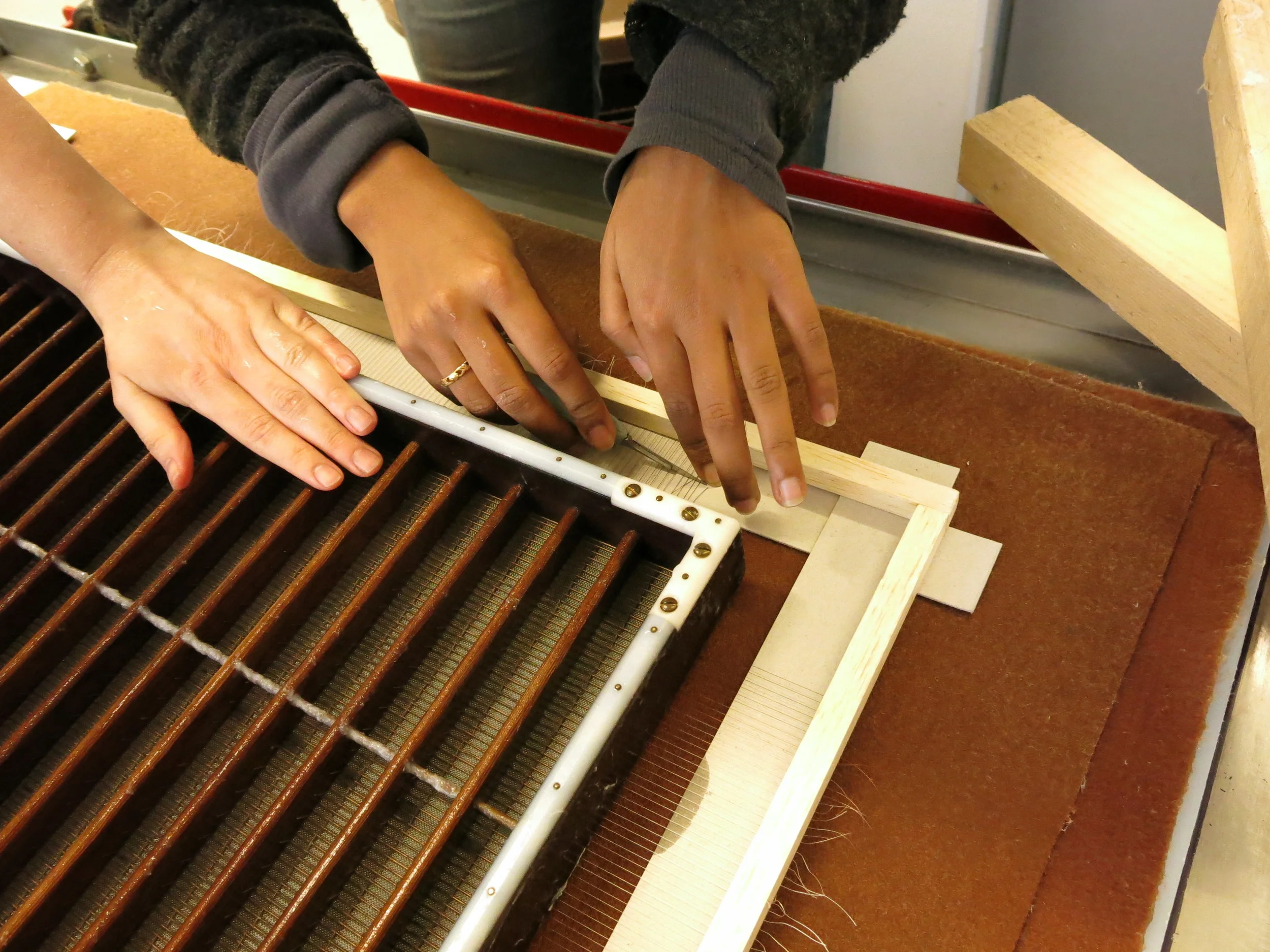 Cutting the threads.