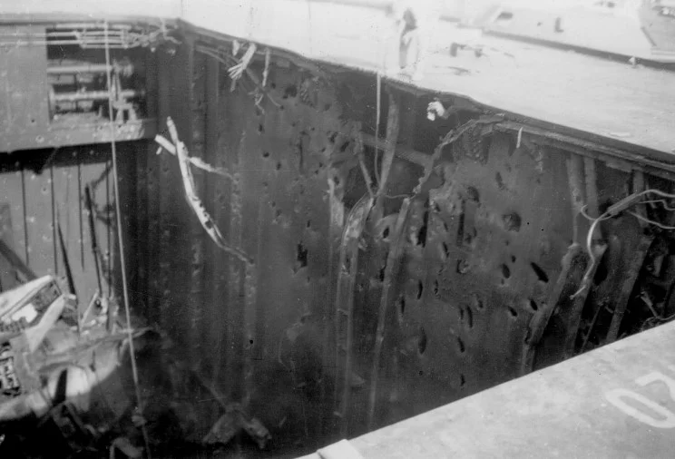 Bullseye ... no less than three bombs entered Illustrious' aft lift well. This picture shows the detonation point of one of these bombs high on the port side.