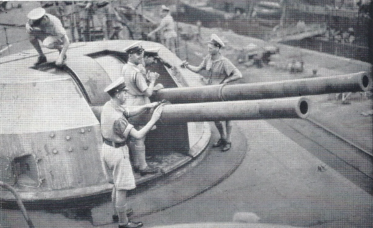 HMS Formidable's crew look over a 4.5in gun turret during HMS Formidable's stay in Norfolk Naval Yards, United States.