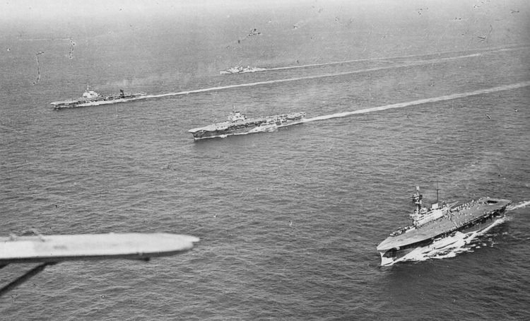 Preliminary movements 3 - 10 August 1942: Aerial view of some of the ships escorting the convoy. Nearest the camera is HMS EAGLE, then HMS INDOMITABLE and HMS VICTORIOUS and in the background are HMS FURIOUS and HMS ARGUS.