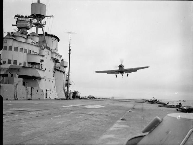 A Hawker Sea Hurricane of 885 Squadron, Fleet Air Arm flying over the flight deck of HMS VICTORIOUS prior to landing after flying exercises.