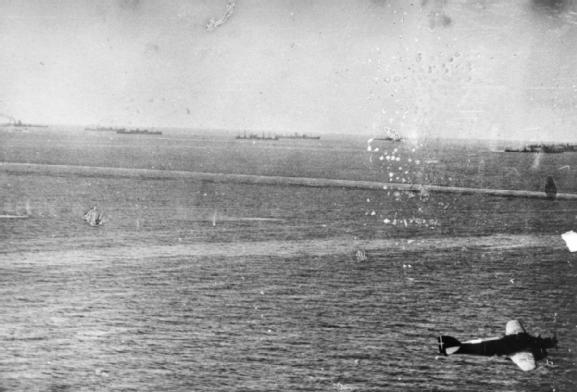 12 August: Air attacks: An Italian photograph of the convoy under attack. An Italian SM.79 torpedo bomber is in the right of the photograph.