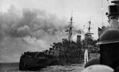 A destroyer comes alongside HMS NIGERIA after the cruiser was torpedoed on August 12.