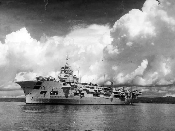 HMS UNICORN, a floating aircraft repair and maintenance factory, on station in Leyte.