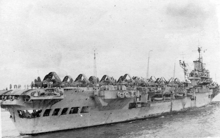 Corsairs arrayed on the deck of HMS FORMIDABLE - identifiable by her distinctive radar mast protruding onto the deck...
