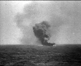 Indefatigable burns after the kamikaze impact.