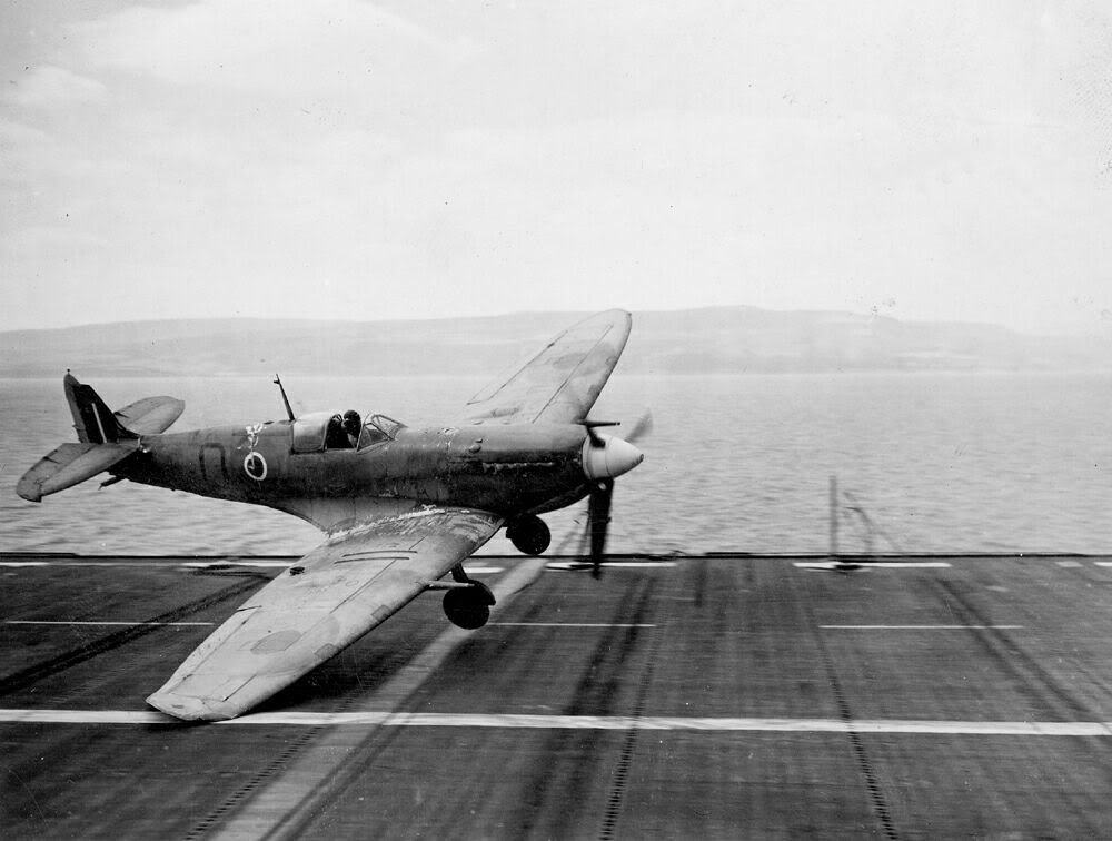 A Seafire trapped by its characteristic "float" upon touch-down about to go into the crash barrier aboard HMS RAVAGER.