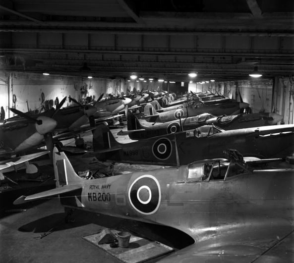 Non-folding Seafire IBs and IICs stowed within HMS INDOMITABLE's hangar in 1943.