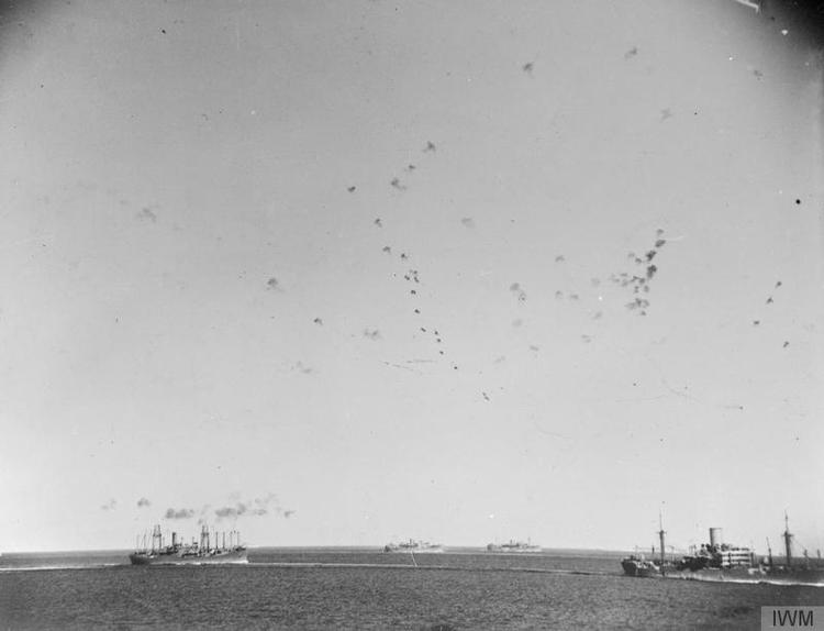 The sky is filled with anti-aircraft shells as the convoy steams on to Malta.