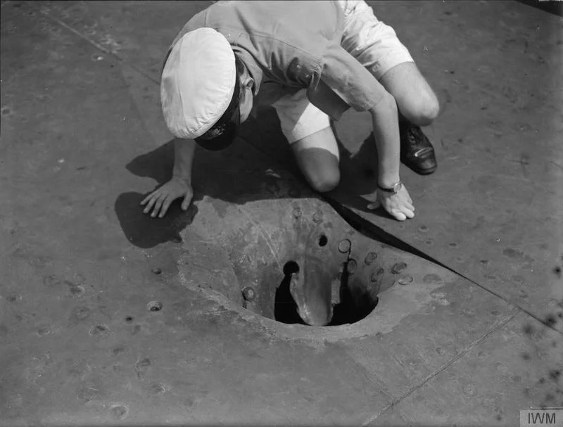 The 14in penetration hole near Indomitable's forward lift.
