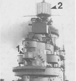 HMS Indomitable, 1943: The Type 271 surface-search radar 'lantern' can be seen in front of the bridge windows (1), while the Type 72 aircraft homing beacon is the large drum at the base of the mast (2).