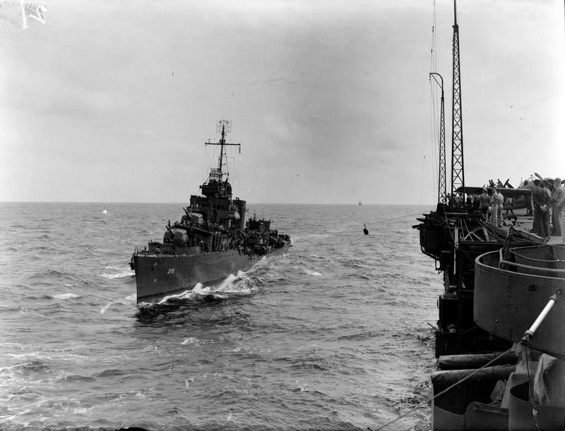 A US destroyer comes alongside 'USS Robin' (HMS VICTORIOUS).