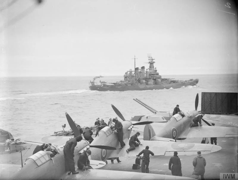 USS WASHINGTON as seen over the Sea Hurricanes aboard HMS VICTORIOUS in July 1942.