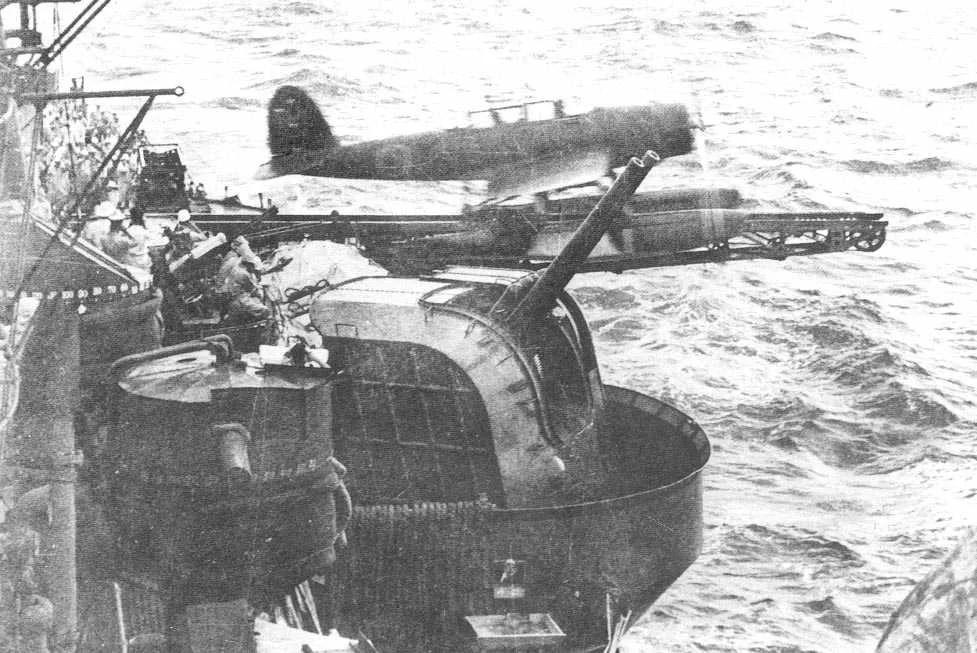 An Aichi E13A recon seaplane launches from the portside catapult of the Myōkō-class cruiser Ashigara