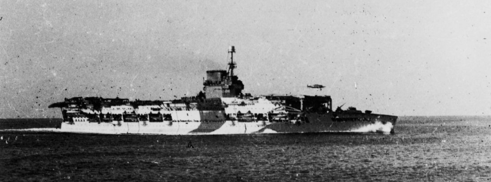 HMS GLORIOUS flies off RAF Hurricanes of 46 Squadron.