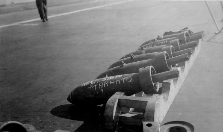No return address... 250lbs bombs arrayed on HMS ILLUSTRIOUS' dek during the 'bombing-up' process shortly before the attack on Taranto.