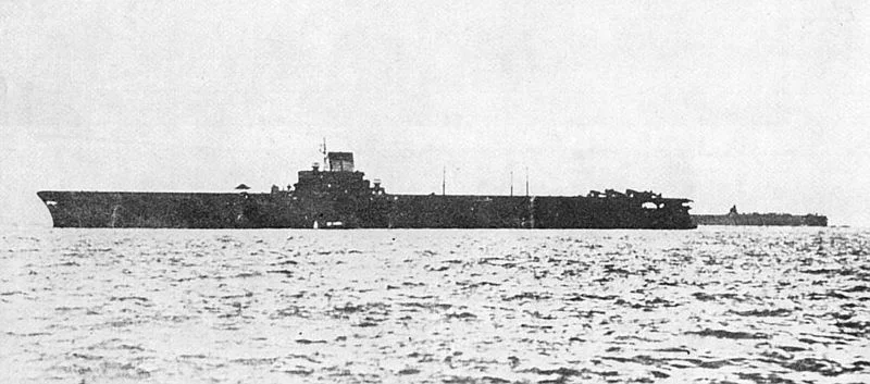IJN Taiho at Tawitawi, Borneo, May 15-16, 1944. A tent has been positioned in the middle of her flight deck forward of the island to offer some protection from the searing tropical sun to her deck crew.