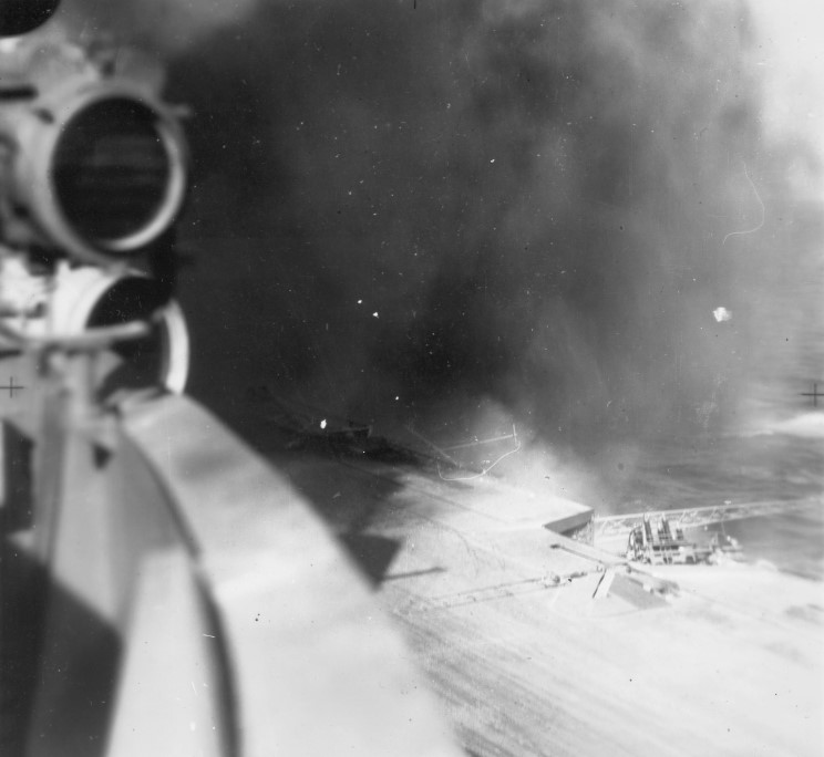 Smoke rises after a bomb bursts on HMS Illustrious' aft deck.