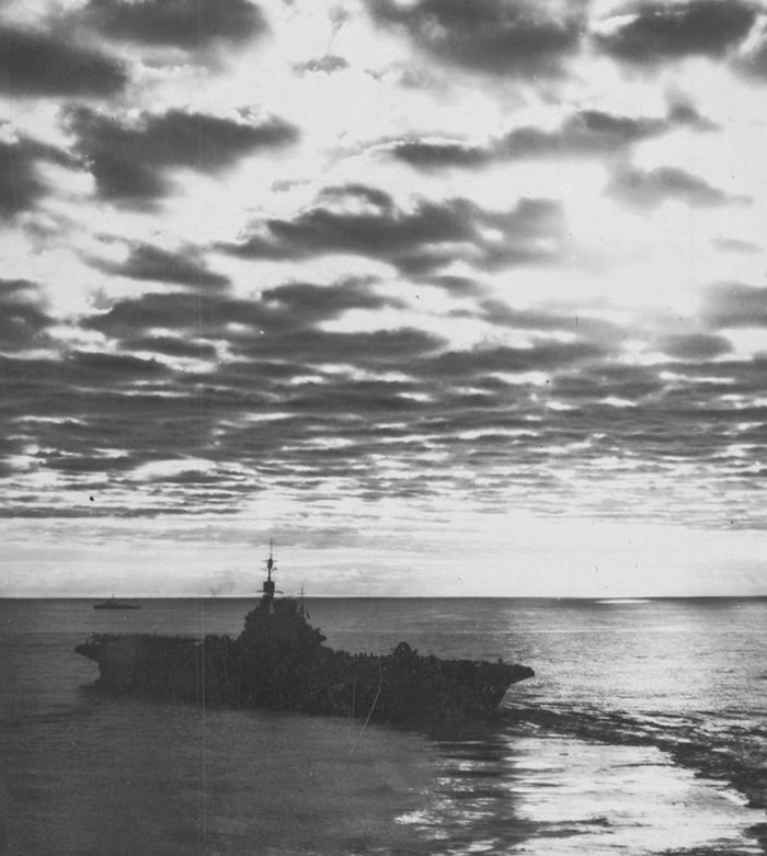 HMS ILLUSTRIOUS and an escorting destroyer in Far Eastern waters.
