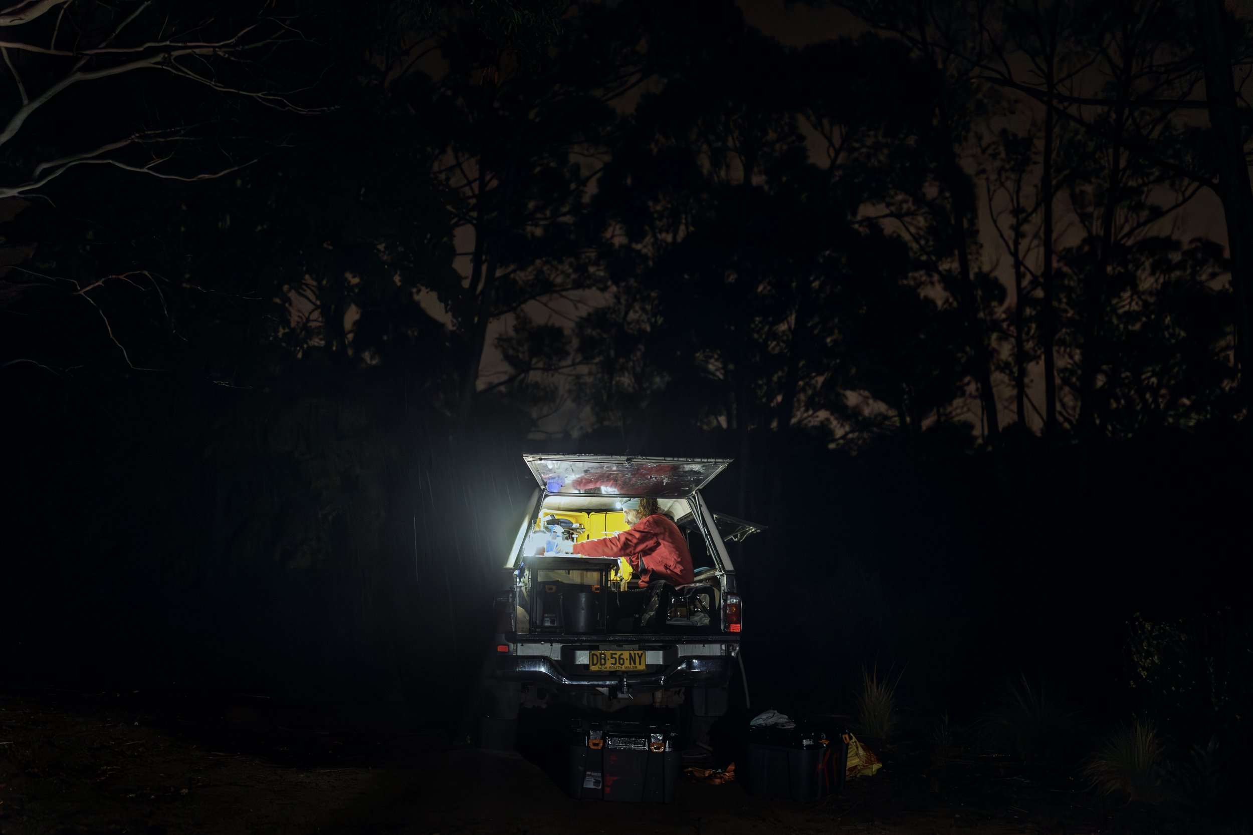  Professor Gilad Bino performing health checks in a mobile laboratory in the back of his four wheel drive truck, during pouring rain in middle of the night.   