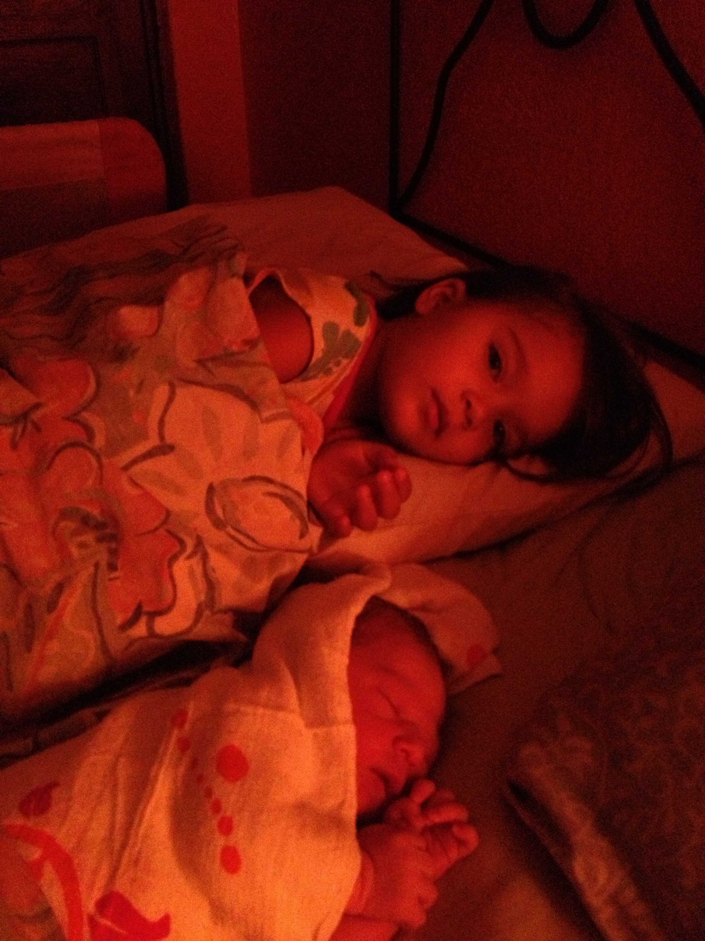 My girls, all three of us snuggled up in bed just hours after Amelie's birth.