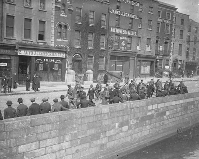 Irish Volunteer being led along the quays by British soldiers after their surrender
