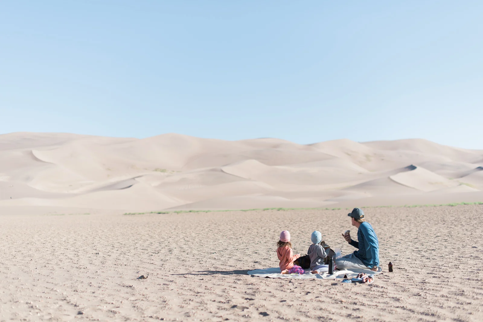 Our breakfast during a crisp cool morning at the Great Sand Dunes National Park. // kiddos pictured wearing our merino hoodies and beanies .