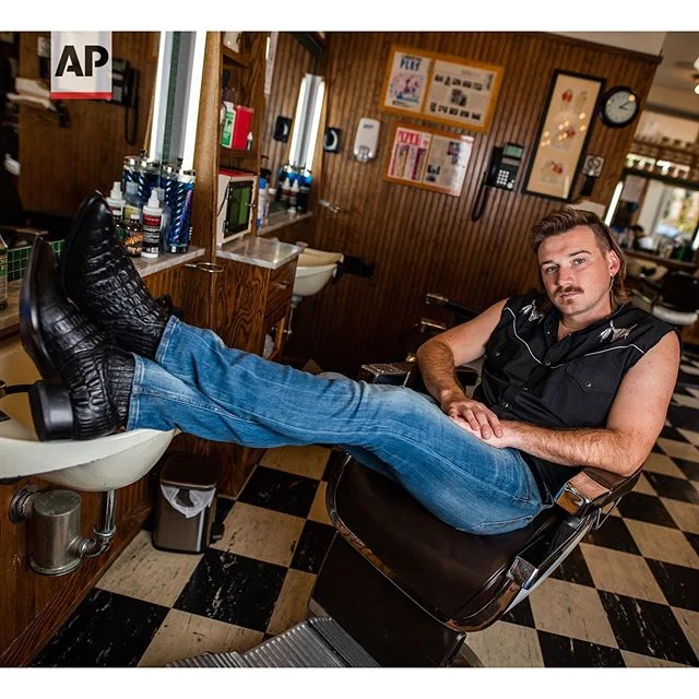Country singer Morgan Wallen poses for a portrait after getting a mullet at Paul Mole Barber Shop on Tuesday, Aug. 27, 2019, in New York. Wallen, who has turned heads with his likable hit song “Whiskey Glasses," said he decided to try a mullet after seeing old photos of his dad proudly rocking the hairstyle. (Photo by Charles Sykes/Invision/AP). Story by @musicmesfin
