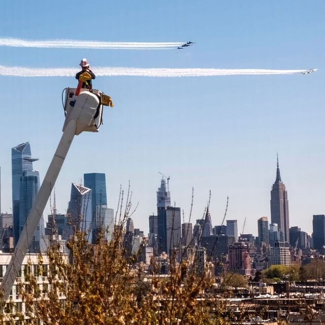 Photo from my kitchen - PSE&amp;G worker watches Blue Angels and Thunderbirds flyover NYC