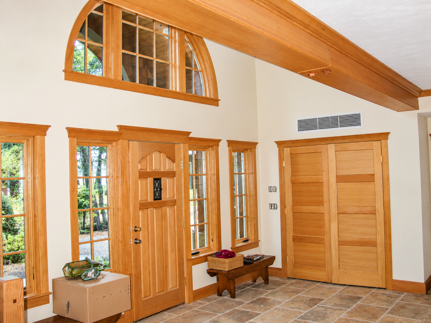 Warm Craftsman Foyer with Arched Transom Window.png