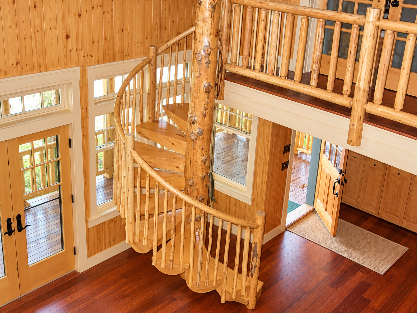 Rustic Cabin Foyer with Spiral Staircase.png