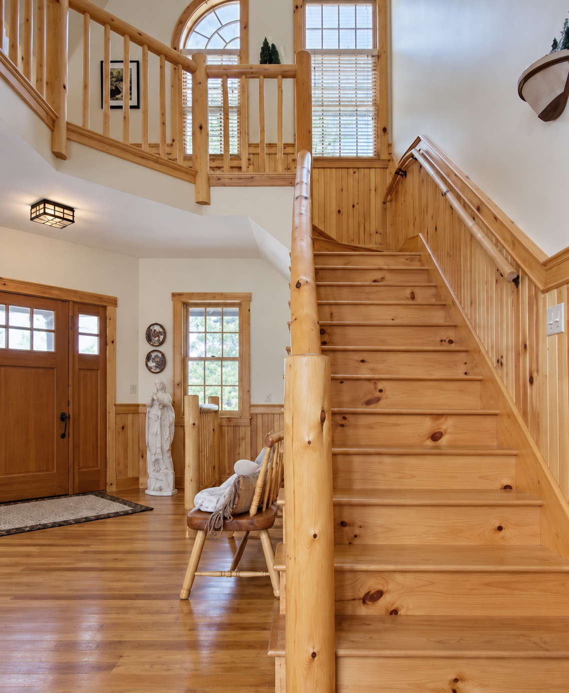 Bright Rustic Wood Foyer Staircase.png