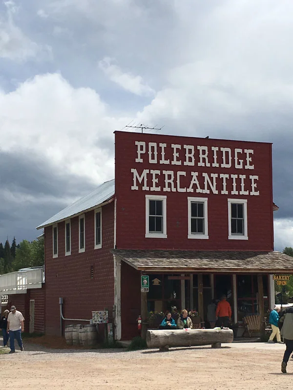 The store (now the Polebridge Mercantile) was completed in 1914. An icehouse and shop were added soon after. A barn, which burned to the ground in the Red Bench fire of 1988, was completed in the early 1920s. Known in the early days simply as Adair’s, it was the social and business hub of the North Fork and a gateway to the new national park across the river. These five buildings make up the W.L. Adair General Mercantile Historic District. The District was placed on the National Register of Historic Places in 1983 as representative of an early Montana mercantile enterprise.