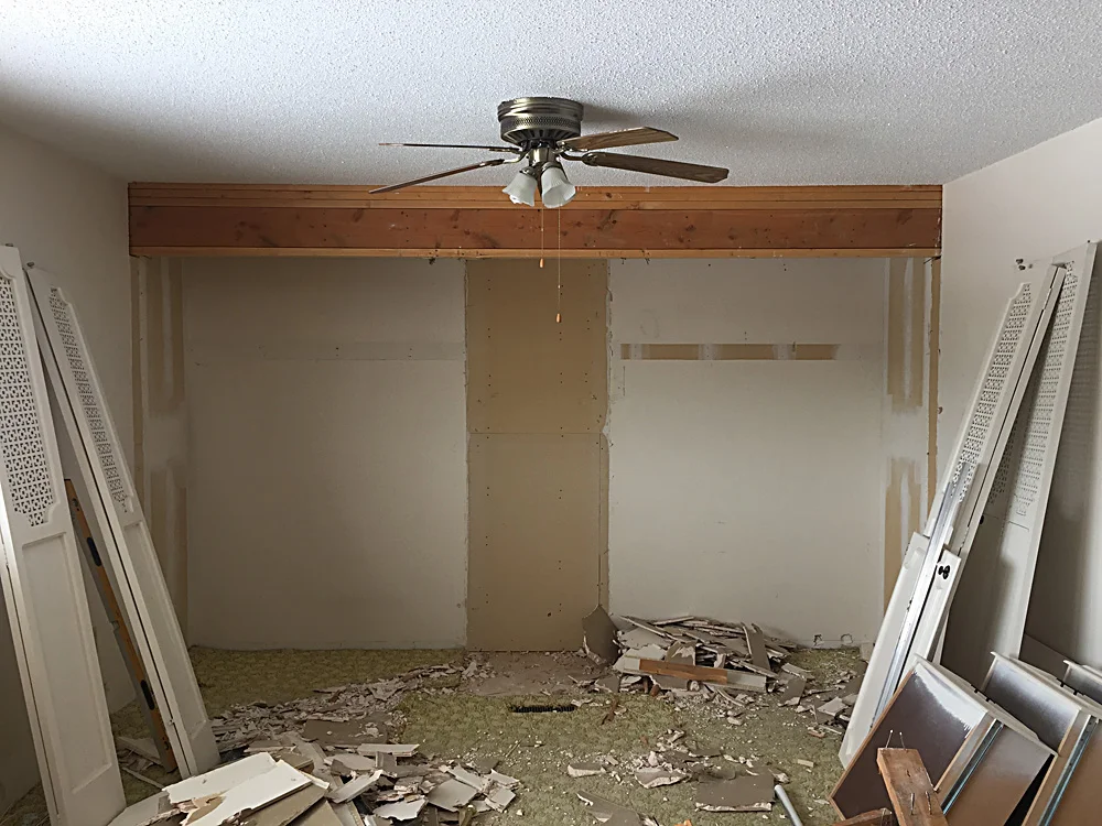 Who thought it was a good idea to use such a giant header beam above the closets?