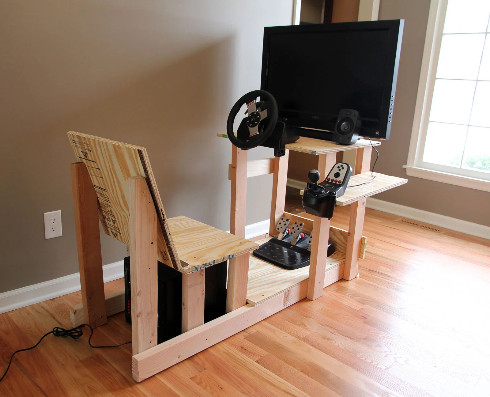 Unpainted chair with plywood seat and gaming hardware