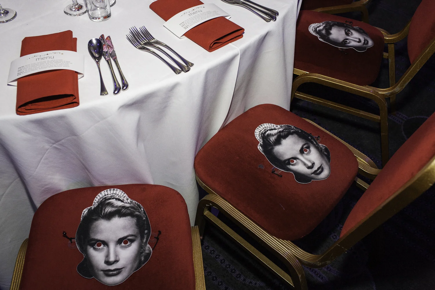 Different famous actors and actresses were on each table as masks.