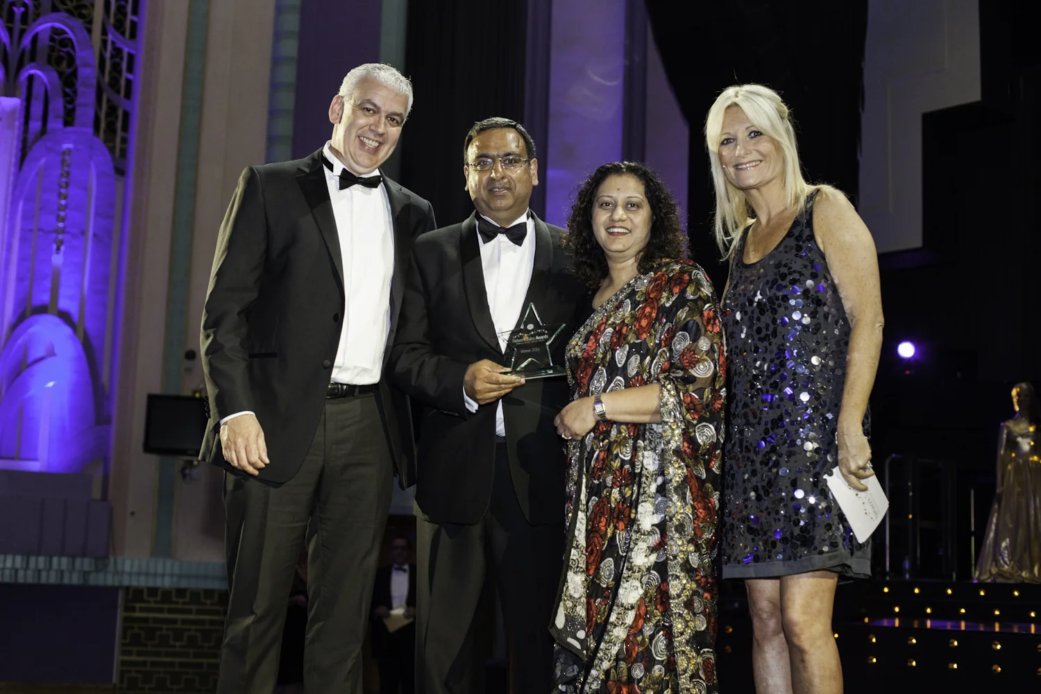 Television star Gaby Roslin presents awards to winners of the Post Office awards at the Troxy